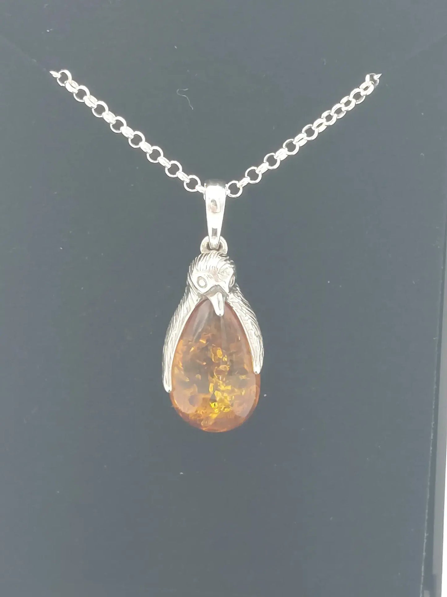 Amber penguin pendant